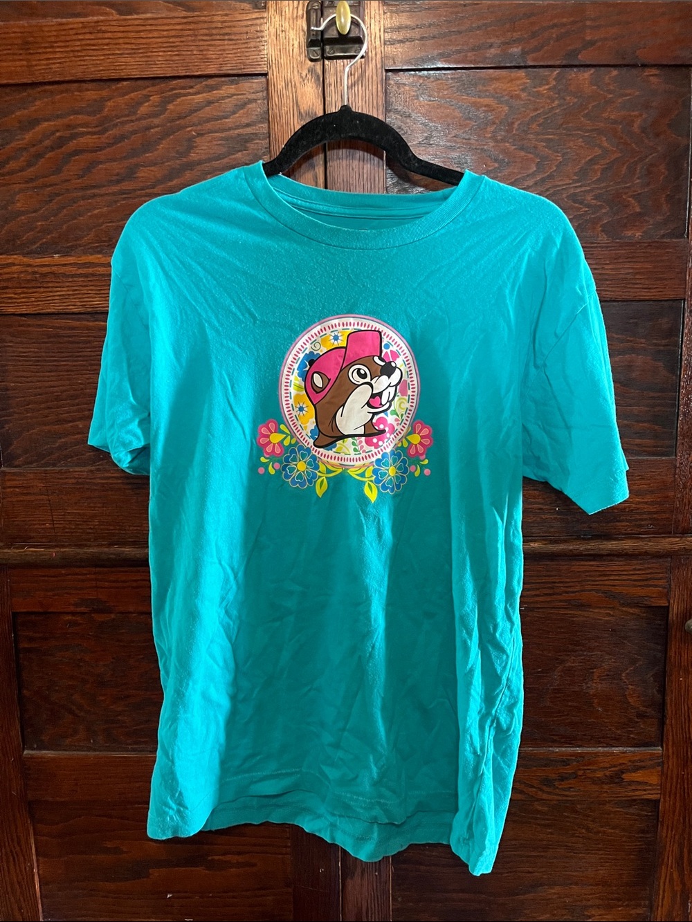 Turquoise bucees Graphic Tee with Playful Cartoon Character